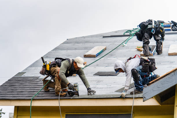 Professional Gutter Installation technician working in Russell, IL